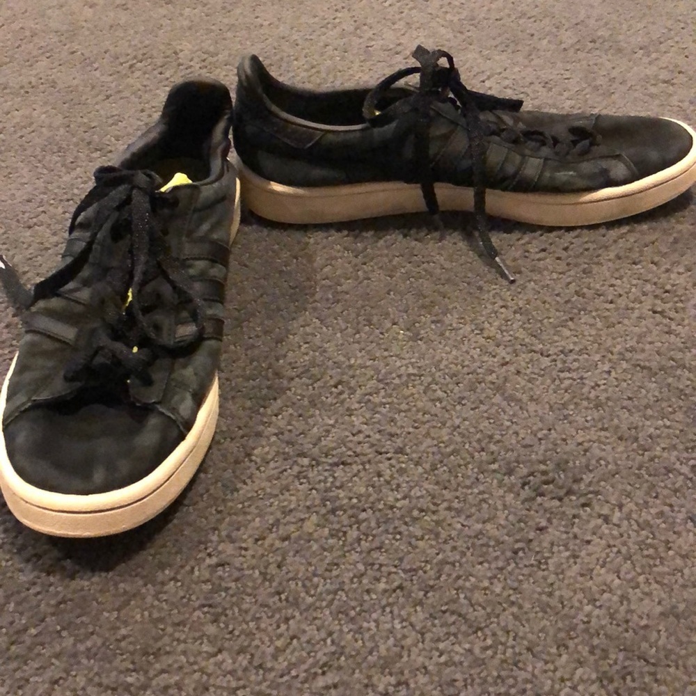 Black adidas sneaker wither green tongue